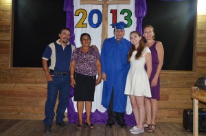 One of the graduates with his parents and sponsors.